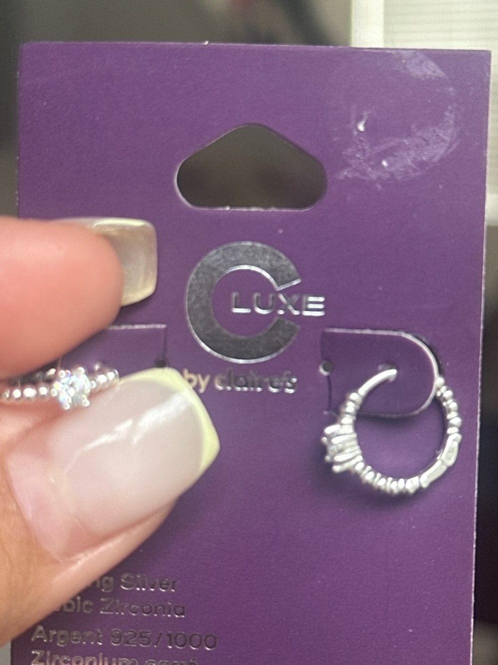 Claire’s Silver diamond ring style earring la with CZ